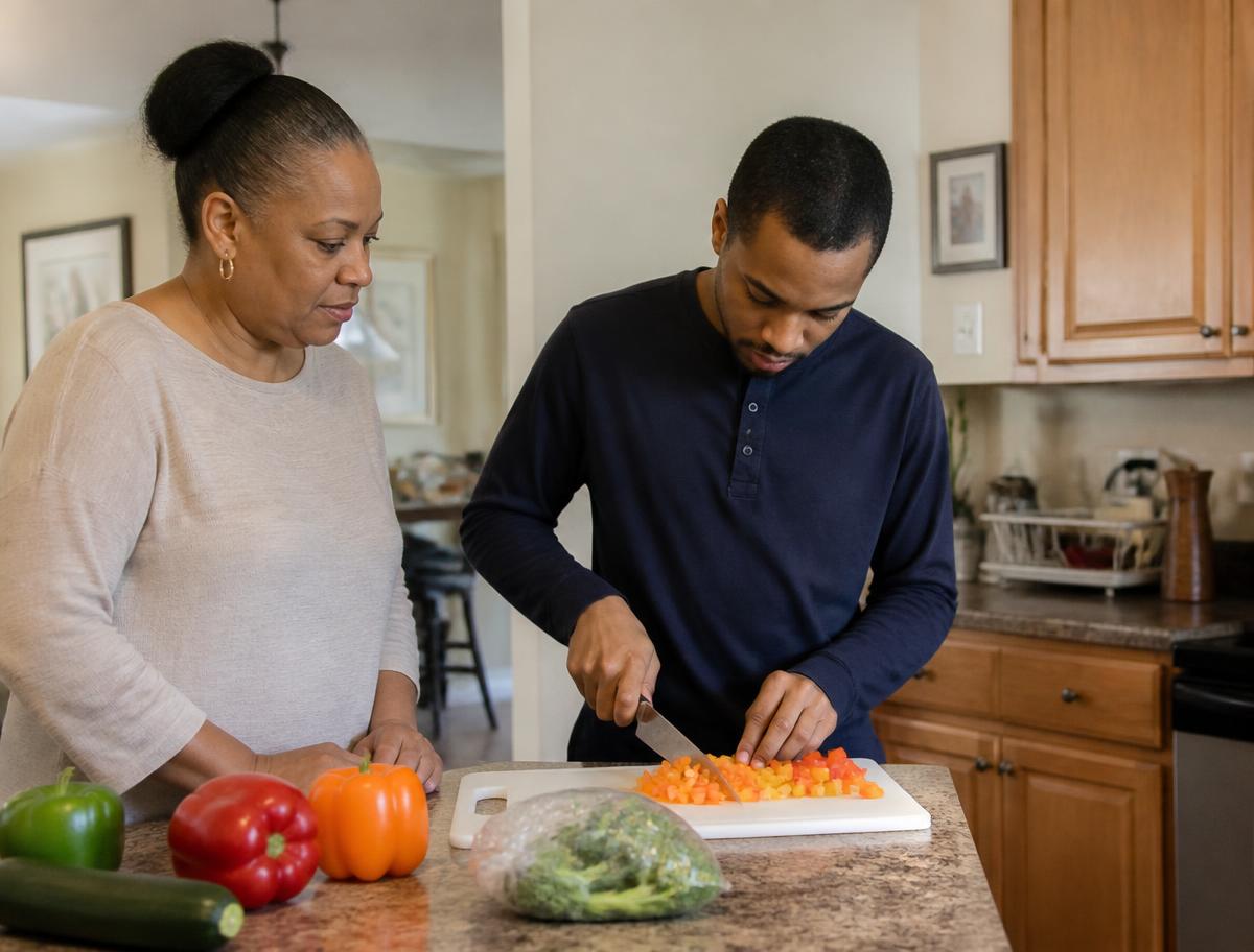 A mother and her adult son preparing a meal together at the counter of their home kitchen
